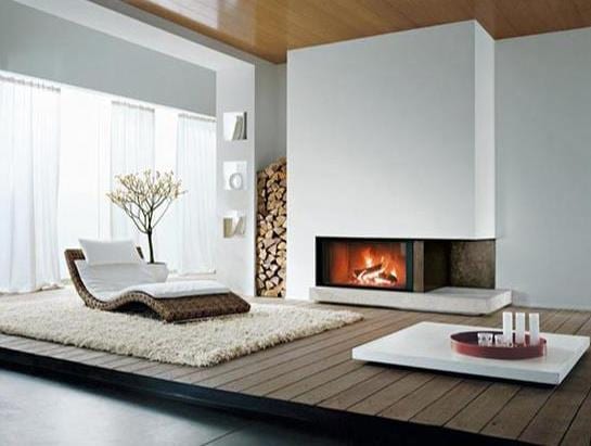 minimalistische interior für luxus wohnzimmer mit kamin und rattanliegestuhl